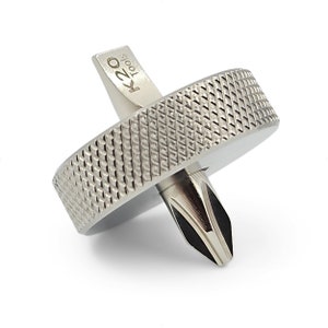 May include: A silver metal spinning top with a black tip and the text "K20 Tools" engraved on the side.