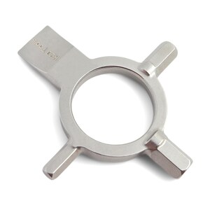 May include: A silver metal tool with a circular center and four arms extending outwards. The tool has the text "K20 Tools" on one end. The arms have a hexagonal shape.