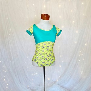 Women&#39;s ballet leotard in yellow floral with teal mesh accents