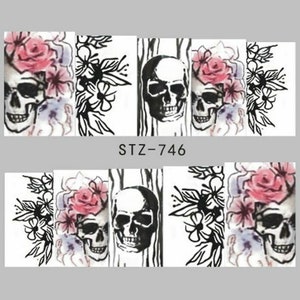 May include: Nail art stickers with a black and white skull design with pink flowers. The stickers are labeled "STZ-746".