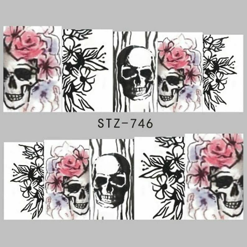 May include: Nail art stickers with a black and white skull design with pink flowers. The stickers are labeled "STZ-746".