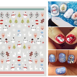 May include: A sheet of nail stickers with a winter theme. The stickers feature snowmen, reindeer, snowflakes, gingerbread men, and Christmas trees. The stickers are white, red, green, and brown.