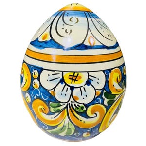 Caltagirone ceramic egg with baroque decoration and flowers, cobalt blue background - height 15 cm