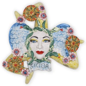 Caltagirone ceramic Trinacria, with applications of cart wheels and flowers, h 38 cm approx. Mod RP