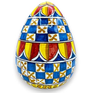Caltagirone ceramic egg, approx. 22 cm high, with a red, yellow, and blue Sicilian cart decoration.