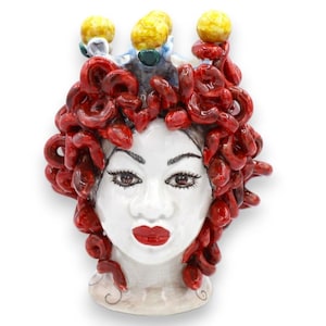 Head of Medusa, mythological figure in Caltagirone ceramic, approx. 20 cm high. Red snakes on an antique white background.
