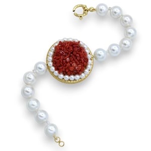Bracelet of large natural pearls with brass medallion studded with bamboo coral and beads, L 20 cm approx.