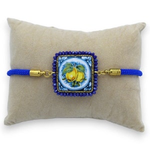 Bracelet with blue lava stone tile, fabric cord, L 22 cm approx. blue crystals, steel clasp