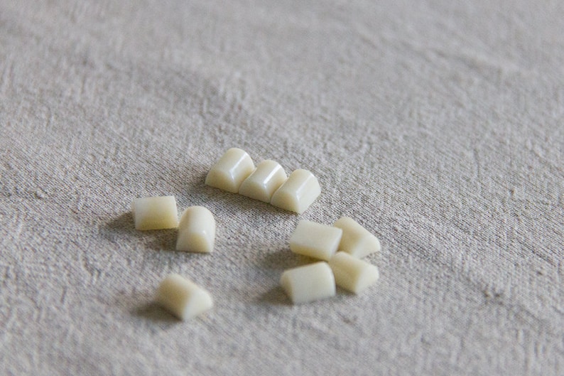 10 vintage unusual pale creamy domed rods or bars or cabochons