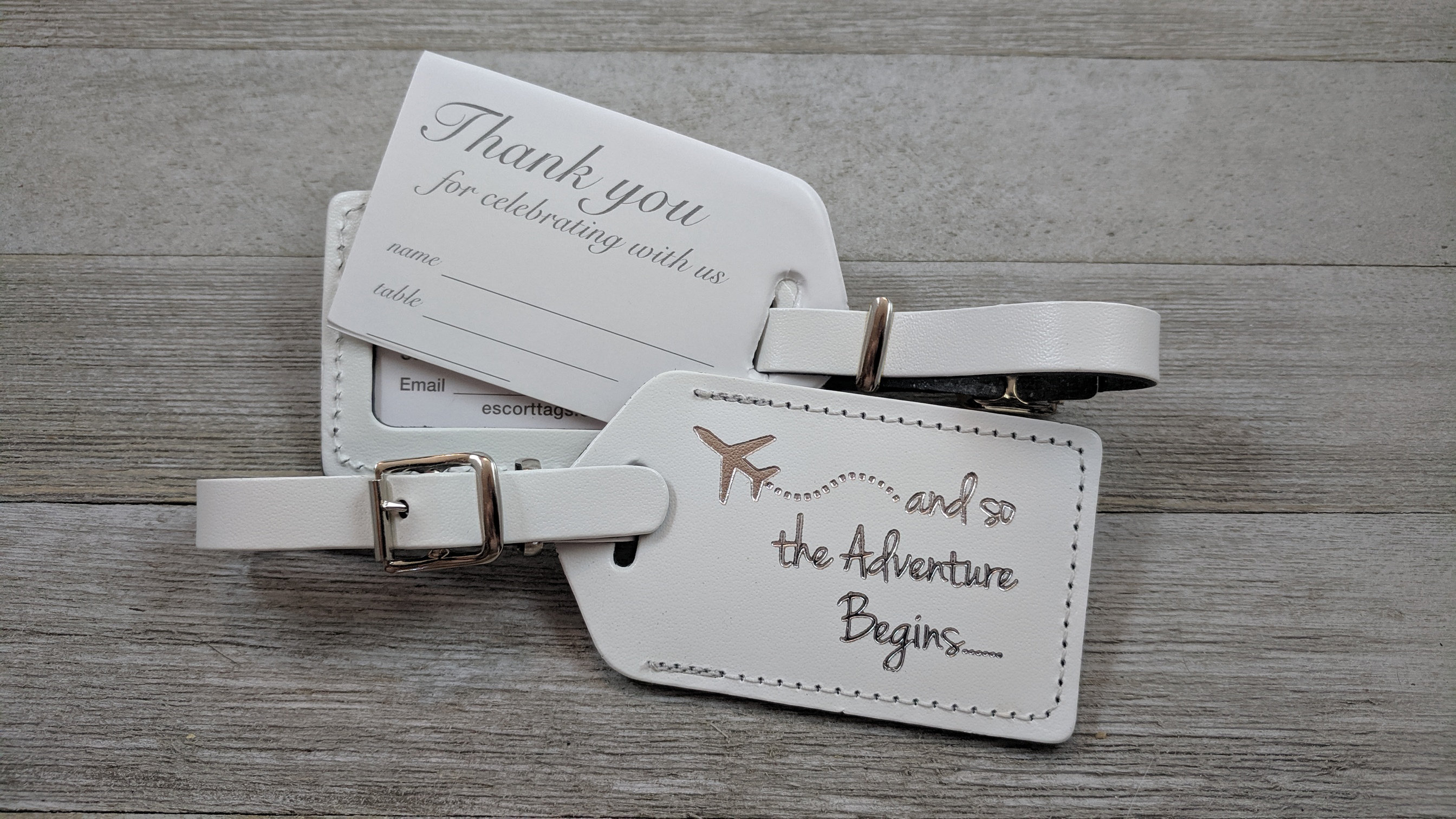 white leather luggage tags