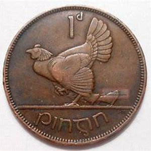 May include: A copper-colored coin with a depiction of a hen and the text "1d" and "ÉIRE" on it.