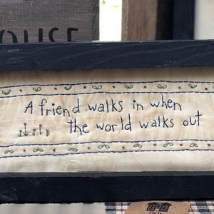 The World Walks Out Primitive Stitchery Framed Print