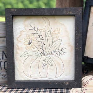 Moonlit Pumpkin Primitive Stitchery Framed Print