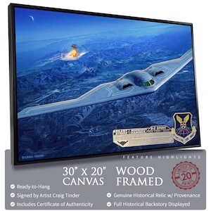 May include: A wood-framed canvas print depicting a B-2 Spirit stealth bomber over a mountain range. The artwork, measuring 76 cm x 51 cm, features the text "SILENT MIDNIGHT STRIKE HAMMER" and is signed by artist Craig Tinder. Includes a certificate of authenticity.