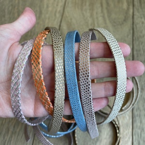 Assorted 10mm wide flat, metallic embossed leather