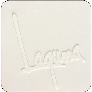 May include: A white ceramic tile with the word "Laguna" embossed in the center.