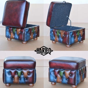 May include: A multi-colored leather storage ottoman with a tufted top and wooden legs. The ottoman has a hinged top that opens to reveal a storage compartment.
