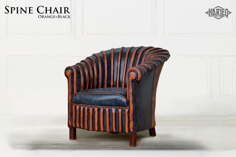 May include: A black and orange leather armchair with a unique, ribbed design. The chair has a rounded back and a comfortable seat. The chair is called "Spine Chair" and is labeled "Orange + Black".