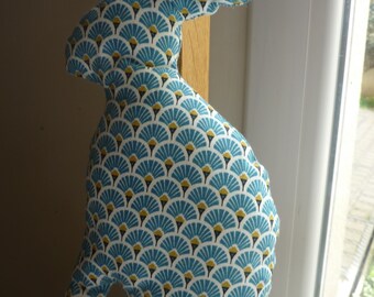 The toy in blue printed cotton