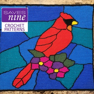 May include: A crochet pattern of a red cardinal bird perched on a branch with purple flowers. The pattern is designed to look like stained glass.