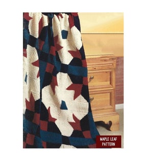 May include: A crocheted blanket with a patchwork design featuring red, white, and blue stars. The blanket is draped over a wooden dresser with three drawers. The text "Maple Leaf Pattern" is visible in the bottom right corner of the image.
