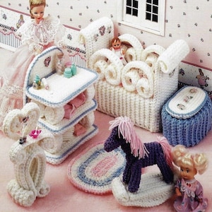May include: A dollhouse nursery set with crocheted furniture, including a crib, changing table, rocking horse, and a rug. The set is in white, blue, and pink colors.