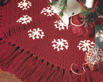 May include: Red crocheted Christmas tree skirt with white snowflake designs and a fringe border.