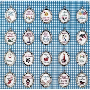 May include: A set of 18 oval-shaped embroidery hoops with various designs and sayings. The hoops are silver with a white background and colorful embroidery. Some of the sayings include "Mothers are Special", "For a Special Grandma", "Eggs-tra Special Child", "A Sister is Special", "Happy Birthday", "Whale of a Grandpa", "Extra Special Brother", "Best Wishes", "Huggy Hubby", "Happy Holidays", "Favorite Uncle", "Grade A Teacher", "Noel", "Favorite Aunt", "Cathy", "Seasons Greetings", "Thinking of You", "Friends Make Christmas Special", and "A Father is Special".