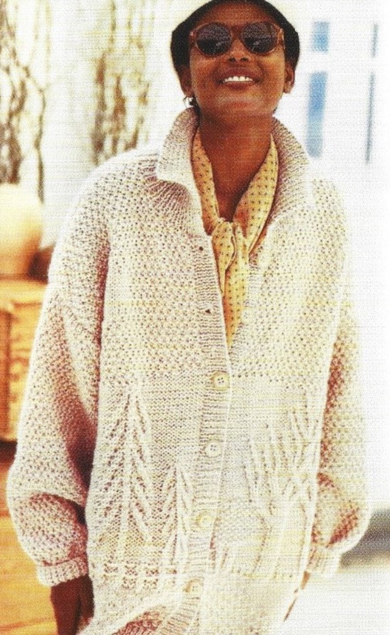 May include: A cream-coloured knitted cardigan with a button-up front and a cable knit pattern. The cardigan has a relaxed fit and long sleeves.