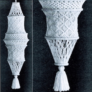 May include: A white macrame hanging lamp with a tassel. The lamp is made of a series of knots and is shaped like a cone. The tassel is at the bottom of the lamp.