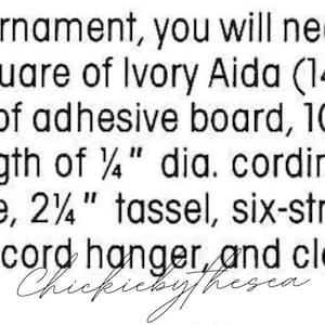 May include: A list of materials needed to make a heart ornament, including tracing paper, ivory Aida fabric, adhesive board, batting, cording, a tassel, embroidery floss, and craft glue.