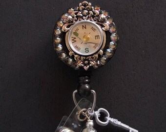 Compass pendant badge reel