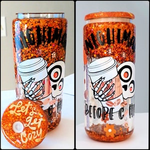 May include: Two orange and brown glitter tumblers with a skeleton holding a coffee cup and the text "Nightmare Before Coffee". One tumbler has a lid with the text "Let's get cozy".