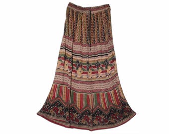 May include: A long, flowing skirt with a colorful, patterned design. The skirt features vertical stripes in red, green, and yellow, interspersed with floral and geometric patterns. The skirt's hemline is adorned with a black floral border.