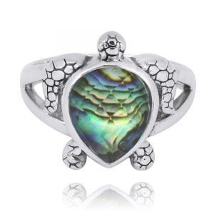 May include: A silver ring featuring a turtle design with a green and blue abalone shell gemstone.