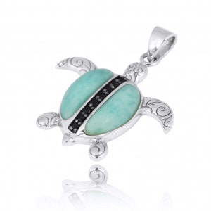 May include: Sterling silver turtle pendant with a green gemstone and black accents. The turtle is detailed with swirls and has a bail for attaching a chain.
