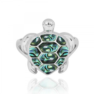 May include: A silver ring with a green and blue abalone shell turtle design.