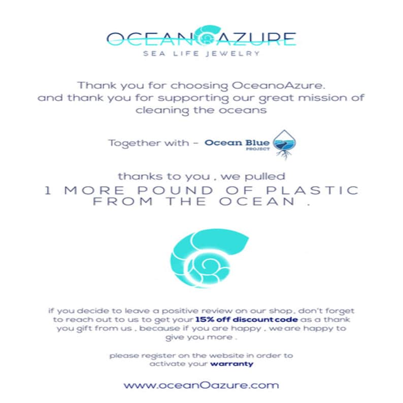 May include: A blue and white graphic with the text "OCEANCAZURE SEA LIFE JEWELRY" and the text "Thank you for choosing OceanoAzure. and thank you for supporting our great mission of cleaning the oceans Together with - Ocean Blue PROJECT thanks to you, we pulled 1 MORE POUND OF PLASTIC FROM THE OCEAN. if you decide to leave a positive review on our shop, don't forget to reach out to us to get your 15% off discount code as a thank you gift from us, because if you are happy, we are happy to give you more. please register on the website in order to activate your warranty www.oceanOazure.com"