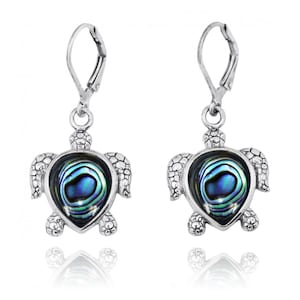 May include: Silver dangle earrings featuring a turtle design with a blue and green abalone shell inlay.