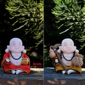 May include: Two crocheted figurines of a smiling monk with a round face and white skin. One wears a red robe and holds a small pouch, while the other wears a yellow robe, carries a brown staff with two attached pouches, and has the text Zeroaha.