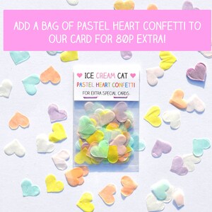 May include: A bag of pastel heart confetti for adding to cards. The bag is labeled "ICE CREAM CAT PASTEL HEART CONFETTI FOR EXTRA SPECIAL CARDS."