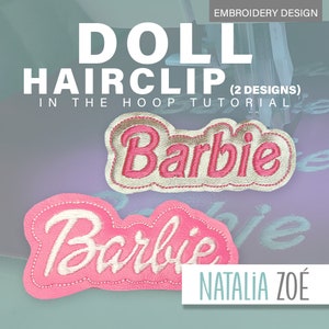 May include: Two embroidered doll hairclips with the name "Barbie" in pink and white. The top clip has a gold border, while the bottom clip has a pink border. The image also includes the text "DOLL HAIRCLIP" and "IN THE HOOP TUTORIAL".