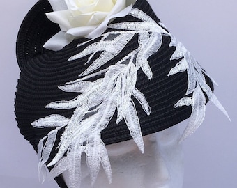 Black and white statement Fascinator with lace leaf embellishment and beautiful white rose