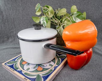 Vintage small white enameled pot with lid