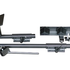 May include: A set of black metal brackets with adjustable arms and a knob for tightening. The brackets are designed for mounting shelves or other objects to a wall.