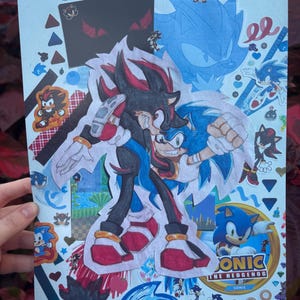 May include: A light blue collage featuring illustrations of Sonic the Hedgehog and Shadow the Hedgehog. The artwork includes various character poses, stickers, and the text "SONIC THE HEDGEHOG". The collage is decorated with blue and red accents.