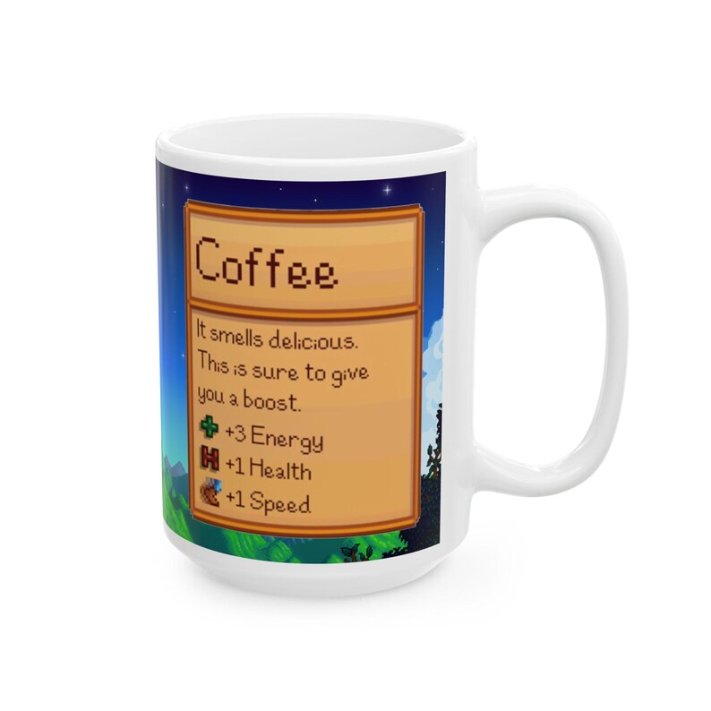 May include: White ceramic mug with a pixelated image of a coffee item from a video game. The image has a brown wooden frame and text that reads "Coffee" and "It smells delicious. This is sure to give you a boost."  The image also includes icons for energy, health, and speed with the text "+3 Energy", "+1 Health", and "+1 Speed".
