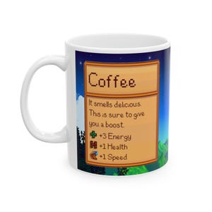 May include: White ceramic mug with a colorful image of a video game-style coffee item. The image features a brown wooden sign with the text "Coffee" and a description of the item's effects: "It smells delicious. This is sure to give you a boost. +3 Energy +1 Health +1 Speed".