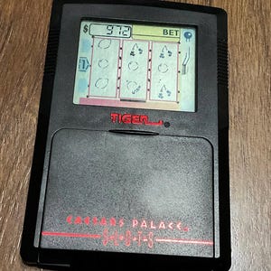 1993 Tiger Electronics Caesar’s Palace Slot Machine Electronic Handheld Game