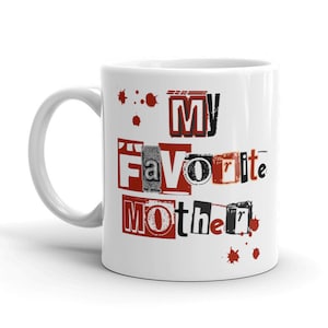 May include: White ceramic mug with a red and black design that says "My Favorite Mother".